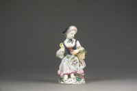 Lot 375 - A Bow porcelain figure of Columbine seated...