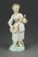 Lot 376 - A Plymouth porcelain figure of a girl holding...