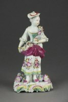 Lot 378 - An early Derby porcelain figure of a girl...