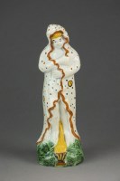 Lot 383 - A prattware figure emblematic of 'Winter',...