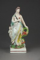 Lot 384 - A Staffordshire pearlware figure of Venus,...