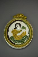 Lot 397 - An early 19th century oval Prattware plaque...