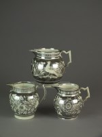 Lot 406 - Three English pearlware silver lustre jugs,...