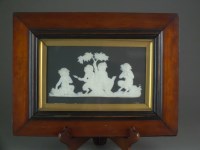 Lot 420 - A framed rectangular Wedgwood black jasperware...