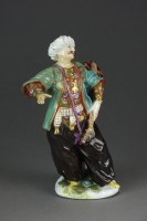 Lot 434 - A Meissen style model of a Turkish Musician,...