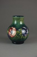 Lot 463 - A Moorcroft green ground vase in the 'Anemone'...