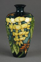 Lot 485 - A Moorcroft Wisteria pattern vase designed by...