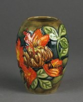 Lot 486 - A Moorcroft Flame of the Forest vase designed...