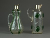 Lot 515 - Two green trailed glass decanters, perhaps...