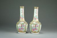 Lot 547 - A pair of Chinese Canton famille rose bottle...