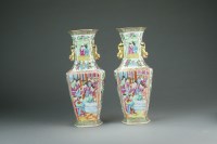 Lot 558 - A pair of Chinese Canton famille rose vases,...