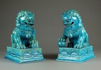 Lot 567 - A pair of Chinese turquoise glazed guardian...