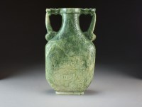 Lot 580 - A large mottled green and white jade vase,...