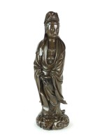 Lot 601 - A large Chinese silver-inlaid bronze figure of...