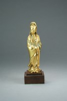 Lot 607 - A gilt metal figure of Guanyin, late Qing...