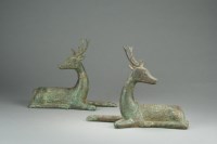 Lot 614 - A pair of Chinese bronze figures of deer, late...