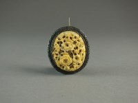 Lot 630 - A Chinese Canton carved ivory brooch, 19th...