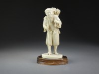 Lot 675 - A good Japanese ivory figure of a peasant by...