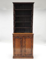 Lot 868 - A mid 19th century mahogany cabinet bookcase,...