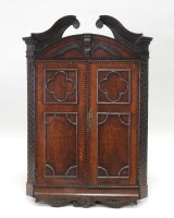 Lot 869 - A George III oak wall hanging straight front...