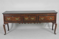 Lot 878 - A George III oak dresser base, the rectangular...