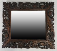 Lot 896 - A Victorian oak framed wall mirror, carved...