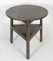 Lot 916 - A George III oak cricket table, the circular...