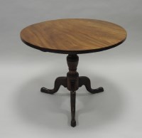 Lot 930 - A George III mahogany tilt top supper table,...