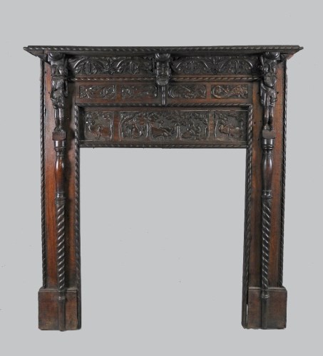 Lot 935 - A 17th century style oak fire surround and...