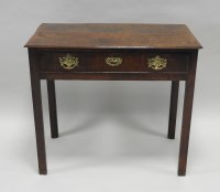 Lot 958 - A George III oak single drawer side table,...