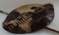 Lot 991 - A Zulu hide shield and two late 19th/early...