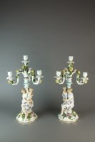 Lot 40 - A pair of Dresden porcelain figural candelabra,...