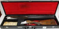 Lot 79 - A 12 bore over and under ejector shotgun by...