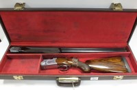 Lot 82 - A 12 bore over and under non-ejector gun by...