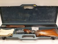Lot 83 - A 12 bore over and under trap gun by Beretta...
