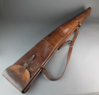 Lot 86 - A Holland and Holland tan leather twin gun...