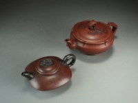 Lot 150 - Two Chinese Yixing teapots, 20th Century, the...