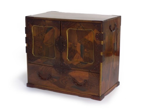 Lot 229 - A Japanese parquetry table cabinet, tansu,...