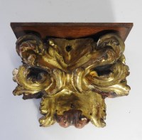 Lot 286 - A carved giltwood wall bracket of scrolling...