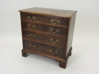 Lot 369 - A George III mahogany chest of four long...