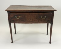 Lot 382 - A George III elm side table, the single deep...