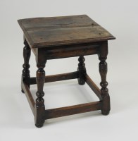Lot 384 - A 17th century and later joined oak stool, the...