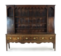 Lot 385 - A George III oak Shropshire type high dresser,...