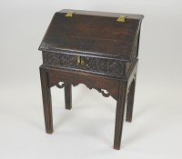 Lot 401 - A 17th century and later oak sloping top box...