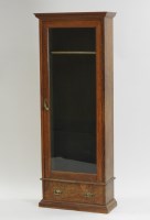 Lot 418 - A late Victorian oak floor standing gun...