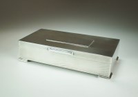 Lot 5 - A Garrards silver mounted cigarette box,...