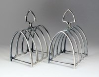 Lot 54 - A pair of silver four division toast racks,...
