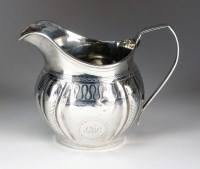 Lot 65 - A George III Irish silver cream jug, Richard...