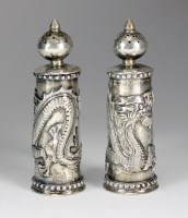 Lot 73 - A pair of Chinese white metal salt and pepper...