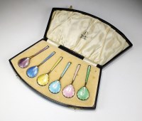 Lot 100 - A cased set of six silver gilt and enamel...